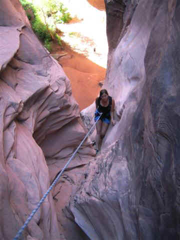 Rachel rappels in Dragonfly Canyon.
